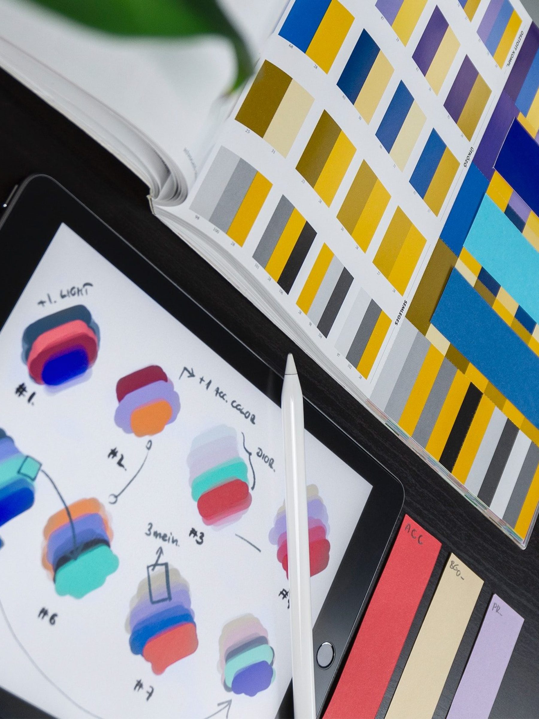 documents of colors palettes put open on table